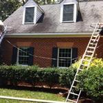 Measuring for a gutter installation.